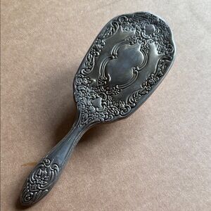 Vintage Ornate hair brush with silver tone metal backing & decorative baroque